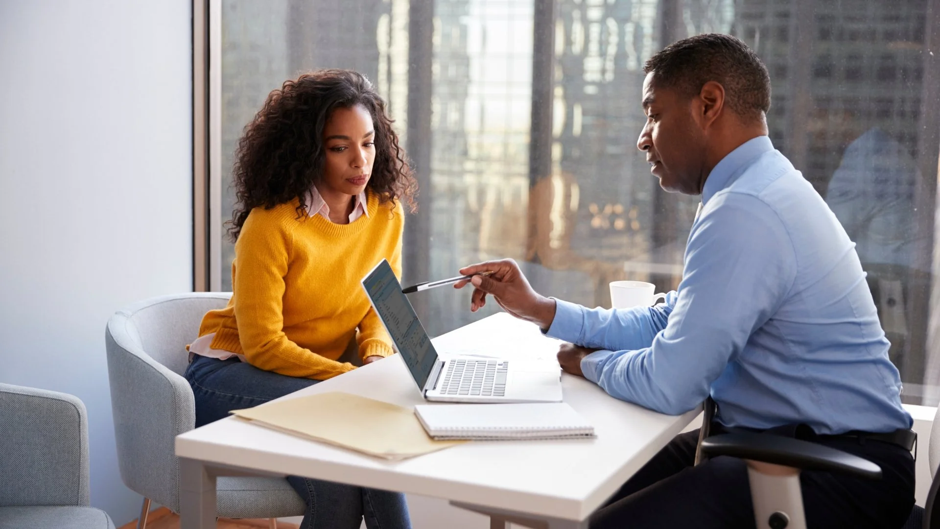 Consultant reviewing information with a client