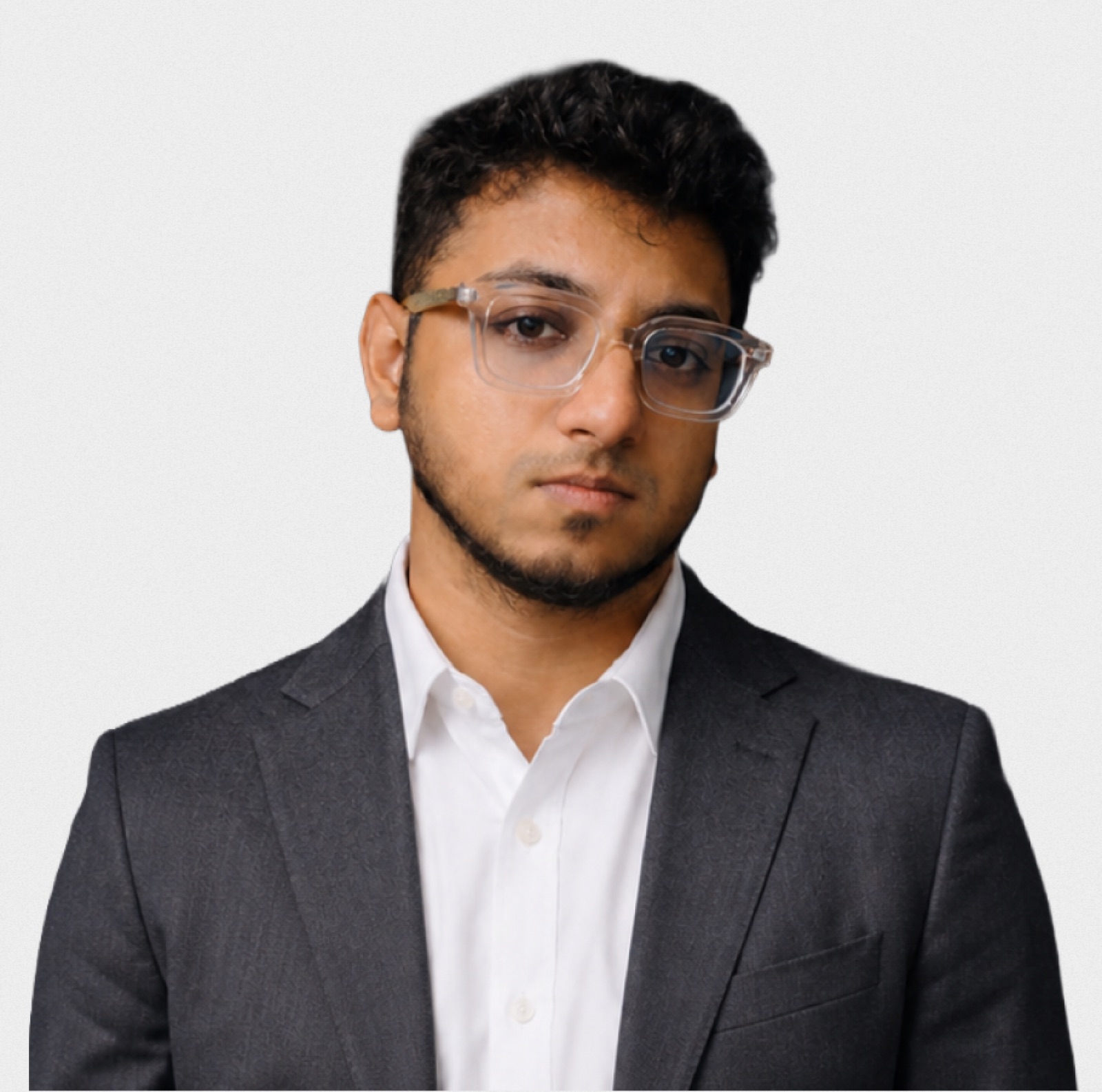 Nasif Fuad, founder of Scalaar, in a charcoal suit and clear glasses